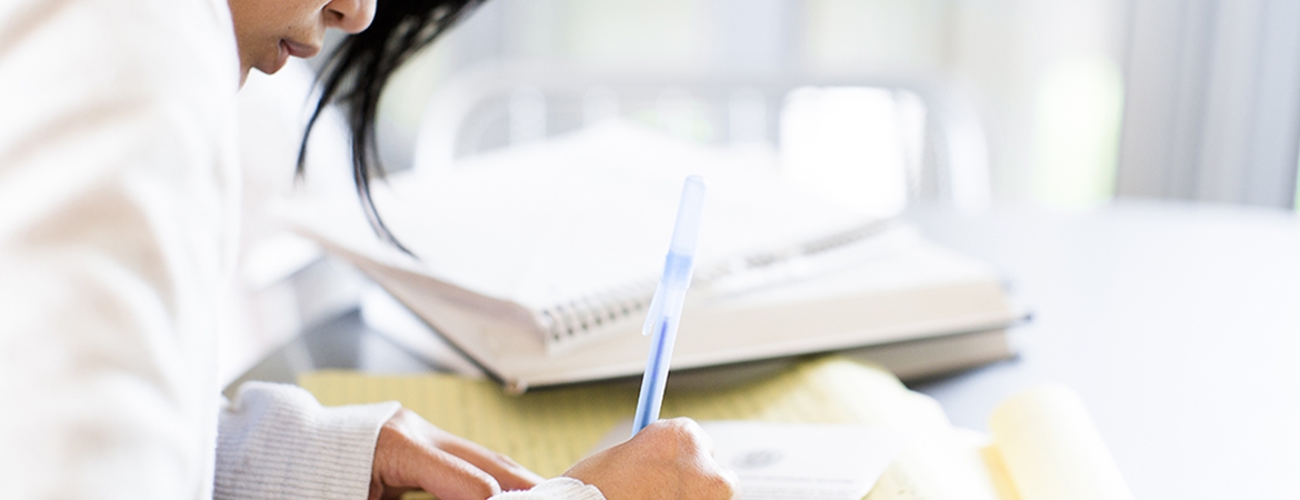 photograph of a student's hands writing